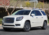 A three-quarter front view of a white 2013 GMC Acadia Denali A three-quarter front view of a white 2013 GMC Acadia Denali