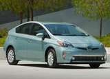 A three-quarter front view of a 2013 Toyota Prius Plug-In Hybrid