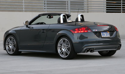 A three-quarter rear view of a 2009 meteor gray pearl Audi TTS Roadster A three-quarter rear view of a 2009 meteor gray pearl Audi TTS Roadster