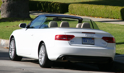 A three-quarter rear view of a white 2010 Audi A5 2.0 TFSI Cabriolet