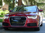 A front view of a red 2012 Audi A6 Quattro