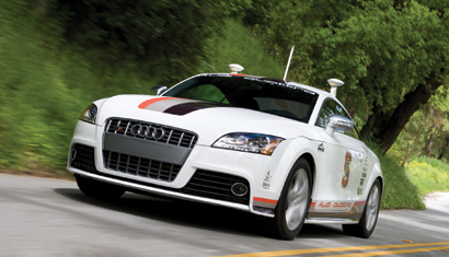 A three-quarter front view of the Pikes Peak Autonomous Audi TTS on the road A three-quarter front view of the Pikes Peak Autonomous Audi TTS on the road