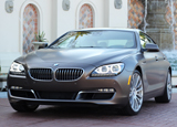 A three-quarter rear view of a 2013 BMW ActiveHybrid 5 A three-quarter rear view of a 2013 BMW ActiveHybrid 5