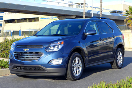 A three quarter front view of the 2016 Chevrolet Equinox FWD LT in patriot blue metallic A three quarter front view of the 2016 Chevrolet Equinox FWD LT in patriot blue metallic
