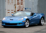 A three-quarter front view of a blue 2011 Chevrolet Corvette Grand Sport Convertible A three-quarter front view of a blue 2011 Chevrolet Corvette Grand Sport Convertible