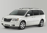 A three-quarter front view of a white 2010 Chrysler Town and Country