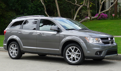 A three-quarter front view of a 2012 Dodge Journey Crew