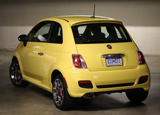 A three-quarter rear view of a yellow 2012 Fiat 500 Sport