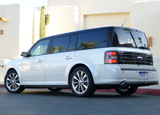 A three-quarter rear view of a white 2011 Ford Flex Titanium A three-quarter rear view of a white 2011 Ford Flex Titanium