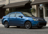A three-quarter front view of a blue 2011 Ford Focus A three-quarter front view of a blue 2011 Ford Focus