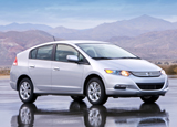 A three-quarter front view of a silver 2010 Honda Insight A three-quarter front view of a silver 2010 Honda Insight