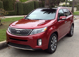 A three-quarter front view of a Kia Sorento A three-quarter rear front of a Kia Sorento