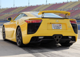 A three-quarter rear view of a yellow 2012 Lexus LFA A three-quarter rear view of a yellow 2012 Lexus LFA