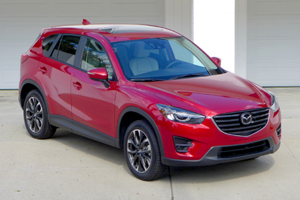 A three-quarter front view of the 2016 Mazda CX-5 Grand Touring FWD A three-quarter front view of the 2016 Mazda CX-5 Grand Touring FWD