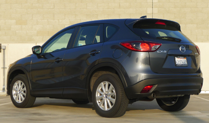 A three-quarter rear view of a 2013 Mazda CX-5 Sport A three-quarter rear view of a 2013 Mazda CX-5 Sport