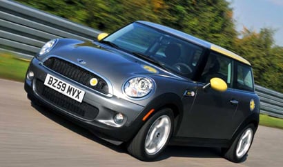 A three-quarter front view of a 2011 Mini E in action