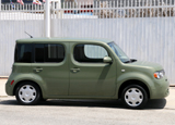 A side view of a green 2010 Nissan Cube A side view of a green 2010 Nissan Cube