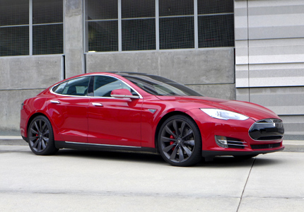 A three-quarter front view of a Tesla Model S electric sedan