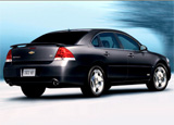 A three-quarter rear view of a black Chevrolet Impala