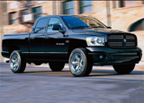 A three-quarter front view of a black Dodge Ram