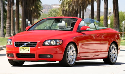 A three-quarter front view of a red 2008 Volvo C70 T5