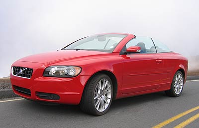 A three-quarter front view of a red 2006 Volvo C70 T5