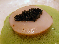 A scallop topped with caviar A scallop topped with caviar