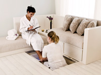 A guest receives a foot bath A guest receives a foot bath