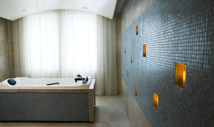 A wet room at Guerlain Spa, with floating rounded ceilings A wet room at Guerlain Spa, with floating rounded ceilings