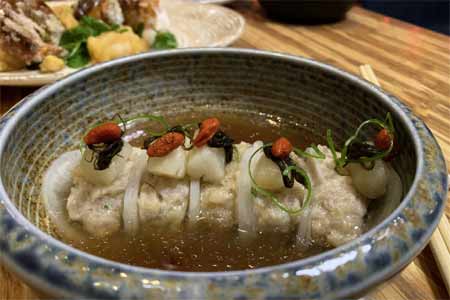 Dragon’s Pearl: scallop & pork dumpling wrapped in daikon, mushroom broth & black moss