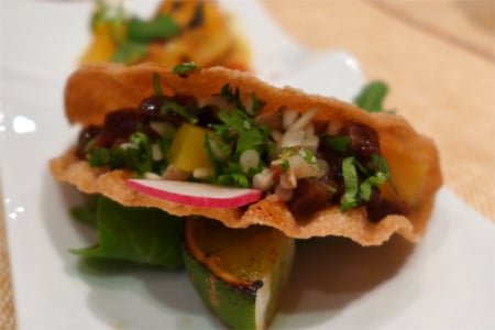 Among the Red Hour offerings at Crustacean are a beef taco in a wonton shell