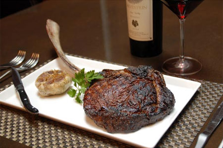 A bone-in ribeye from Red PrimeSteak in Oklahoma City, one of GAYOT's top spots for steak in the country A bone-in ribeye from Red PrimeSteak in Oklahoma City, one of GAYOT's top spots for steak in the country