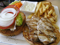 A fish sandwich with french fries; eat well at low prices