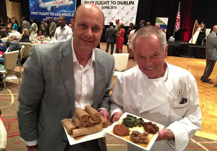 Alain Gayot with chef Wolfgang Puck sampling authentic Ethiopian cuisine
