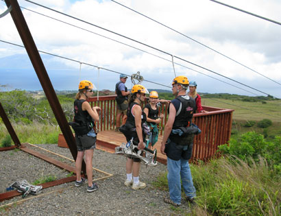 Adventure seekers preparing to zipline Mountain Outpost Adventure seekers preparing to zipline Mountain Outpost