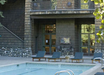 The pool area boasts a one-of-a-kind outdoor pizza oven
