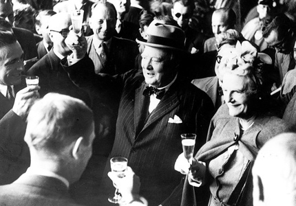 Even politicians need to let loose sometimes; here Sir Winston Churchill toasts with Champagne