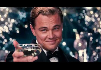 In a scene from the 2013 version of Fitzgerald's The Great Gatsby, Leonardo Dicaprio makes a toast with Champagne