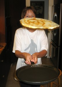 Kids love to flip the crêpe in the pan