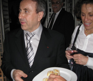 Daniel Boulud serving food in the basement of Bar Boulud at an after party