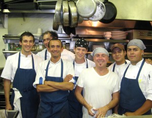 Chef Laurent Quenioux (in a white tee-shirt) from Bistro LQ and his team