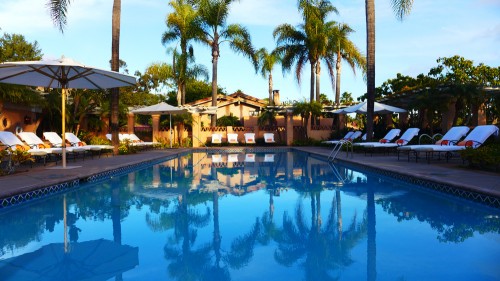 The pool at Rancho Valencia Resort & Spa at sunset