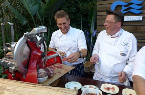 Chef Curtis Stone cooking with Peter Roelant, Manager of Culinary Operations of Princess Cruises