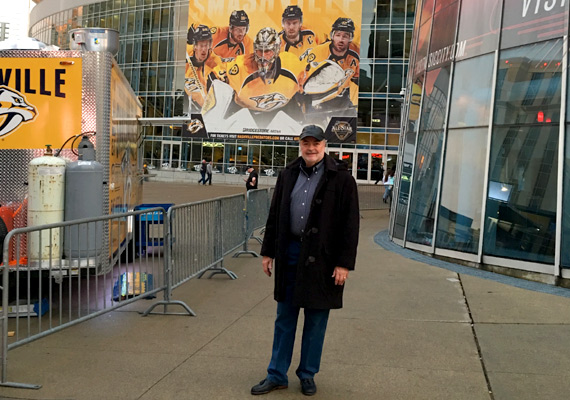 Mike Bell attends a Nashville Predators hockey game at the Bridgestone Area