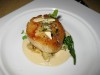 Roasted sea scallops on a bed of cauliflower purée, topped with toasted almonds