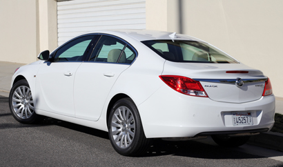 A three-quarter rear view of a white 2011 Buick Regal CXL A three-quarter rear view of a white 2011 Buick Regal CXL