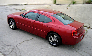 A three-quarter rear view of a red 2006 Dodge Charger R/T