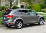 A three-quarter rear view of a 2012 Dodge Journey Crew