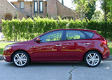 A side view of a red 2011 Kia Forte SX 5-Door A side view of a red 2011 Kia Forte SX 5-Door