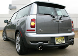 A three-quarter rear view of a gray and white Mini Cooper S Clubman